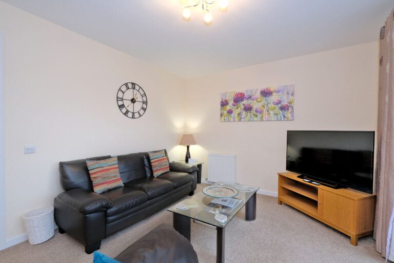 Newhills Apartment's living area with a smart TV, located in Aberdeen, Caledonia Apartments.
